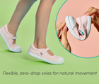 Split view of flexible, zero-drop soles for natural movement and child wearing Ten Little Eco Canvas Mary Janes - Pink Seersucker. Available at www.tenlittle.com