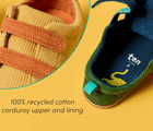 Split view close-up of 100% recycled cotton corduroy upper and lining of Ten Little Eco Corduroy Sneakers - Yellow / Orange, Green / Navy. Available at www.tenlittle.com