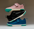 Side view of stacked Ten Little MotionX Sneakers - Stardust Pink, Space Black, Cosmic Blue. Available at www.tenlittle.com