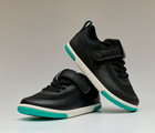 Front and side view of stacked Ten Little MotionX Sneakers - Space Black. Available at www.tenlittle.com