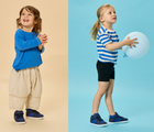 Split view children wearing Ten Little Varsity Mid Tops - Game Day Blue. Available at www.tenlittle.com