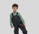 Child wearing Reima Waterproof Rain Pants - Black. Available at www.tenlittle.com