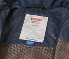 Close up interior ID tag of Reima Reimatec Waterproof Jacket - Tuulela - Peanut Brown. Available at www.tenlittle.com