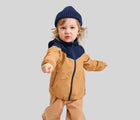 Child wearing Reima Reimatec Waterproof Jacket - Tuulela - Peanut Brown. Available at www.tenlittle.com