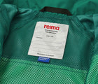 Close up interior ID tag of Reima Reimatec Waterproof Jacket - Tuulela - Summer Green. Available at www.tenlittle.com