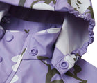 Close up hood snap buttons of Reima Waterproof Rain Jacket - Vesi - Blooming Lilac. Available at www.tenlittle.com