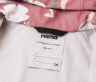 Close up interior ID tag of Reima Waterproof Rain Jacket - Vesi - Rose Blush. Available at www.tenlittle.com