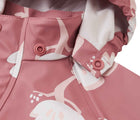 Close up hood snap buttons of Reima Waterproof Rain Jacket - Vesi - Rose Blush. Available at www.tenlittle.com