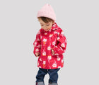 Child wearing Reima Reimatec Waterproof Jacket - Hete - Bright Berry. Available at www.tenlittle.com