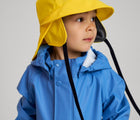 Close up of boy wearing Reima - Waterproof Rain Jacket - Denim Blue - Available at www.tenlittle.com