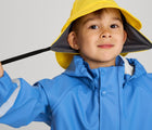 Close up of boy wearing Reima - Waterproof Rain Jacket - Denim Blue - Available at www.tenlittle.com