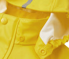 Close up hood snap of Reima - Waterproof Rain Jacket - Yellow - Available at www.tenlittle.com