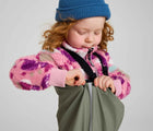 Child closing side snap wearing Reima - Lammikko Waterproof Rain Pants - Greyish Green - Available at www.tenlittle.com