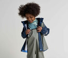 Child wearing Reima - Lammikko Waterproof Rain Pants - Greyish Green - Available at www.tenlittle.com