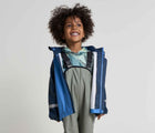 Child wearing Reima - Lammikko Waterproof Rain Pants - Greyish Green - Available at www.tenlittle.com