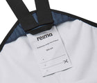 Close up name tag of Reima - Lammikko Waterproof Rain Pants - Navy - Available at www.tenlittle.com