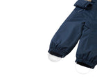 Close up elastic leg ends and silicone foot loops of Reima - Waterproof Reimatec Snowsuit - Gotland - Navy - Available at www.tenlittle.com