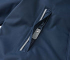 Close up zip pocket of Reima - Waterproof Reimatec Snowsuit - Gotland - Navy - Available at www.tenlittle.com