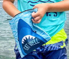 Child utilizing the YumBox Insulated Reusable Bag - 2 Pack Sharks and Monsters. Available from www.tenlittle.com
