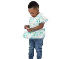 Child wearing the Bumkins Short-Sleeved Art Smock - Dinosaurs. Available from www.tenlittle.com