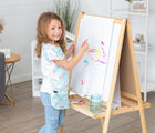 Child painting with the Bumkins Short-Sleeved Art Smock - Rainbows. Available from www.tenlittle.com