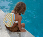 Boy at pool wearing Sunnylife Bubble Back Float - Seagull. Available at www.tenlittle.com