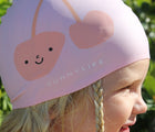 Girl wearing Sunnylife Swimming Cap - Cherry. Available at www.tenlittle.com