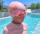 Girl at pool wearing Sunnylife Swimming Cap - Cherry. Available at www.tenlittle.com