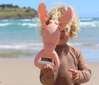 Child holding Sunnylife Sand Claw - Lobster. Available at www.tenlittle.com