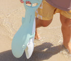 Child holding Sunnylife Sand Claw - Whale. Available at www.tenlittle.com