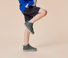 Child wearing Ten Little Mid Top Sneakers - Khaki Green. Available from www.tenlittle.com