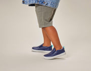 Child wearing Ten Little Slip-On Sneakers - Navy Blue. Available at www.tenlittle.com