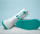 Ten Little Snow Boots in White and Teal. Available at www.tenlittle.com