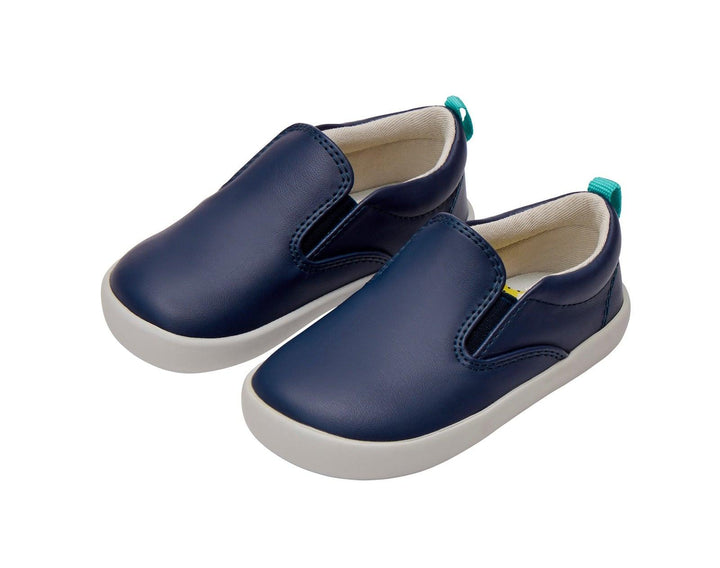 Side and front view of Ten Little Slip-On Sneakers - Navy Blue. Available at www.tenlittle.com