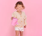 Child wearing Babiators Flower Sunglasses. Available from www.tenlittle.com