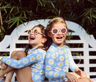 Children wearing Babiators Flower Sunglasses. Available from www.tenlittle.com