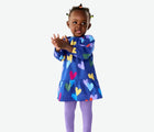 Girl wearing Primary Baby Leggings - 3 Pack - Warm Mix. Available at www.tenlittle.com