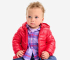 Baby sitting wearing Primary Baby Lightweight Puffer Jacket - Cherry. Available at www.tenlittle.com