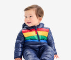 Child sitting wearing Primary - Striped Baby Lightweight Puffer Suit - Navy - Available at www.tenlittle.com