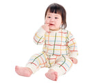 Baby sitting wearing Primary Baby Sweatshirt Romper - Rainbow Grid - Oat / Multi Grid. Available at www.tenlittle.com