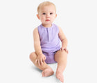 Baby sitting wearing Primary Baby Sleeveless Romper - Iris. Available at www.tenlittle.com