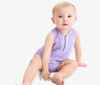 Baby sitting wearing Primary Baby Sleeveless Romper - Iris. Available at www.tenlittle.com