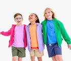 Children wearing Primary Chino Drawstring Shorts - Olive, Khaki, Sunwashed Navy. Available at www.tenlittle.com