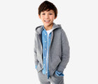 Child wearing Primary - Fleece Zip Hoodie - Heather Storm Gray - Available at www.tenlittle.com