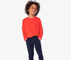 Boy wearing Primary - French Terry Jogger - Navy - Available at www.tenlittle.com