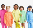 Children wearing Primary Gym Shorts - Goldfish and Buttercup. Available at www.tenlittle.com