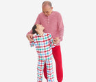 Adult with child wearing Primary Holiday PJ Set - Peppermint Plaid - Ivory Multi Plaid. Available at www.tenlittle.com