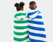 Kids wearing Primary Hooded Towel - Assorted Colors. Available at www.tenlittle.com