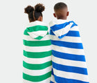 Kids wearing Primary Hooded Towel - Assorted Colors. Available at www.tenlittle.com