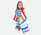 Toddler wearing Primary Hooded Towel - White / Rainbow Stripe. Available at www.tenlittle.com